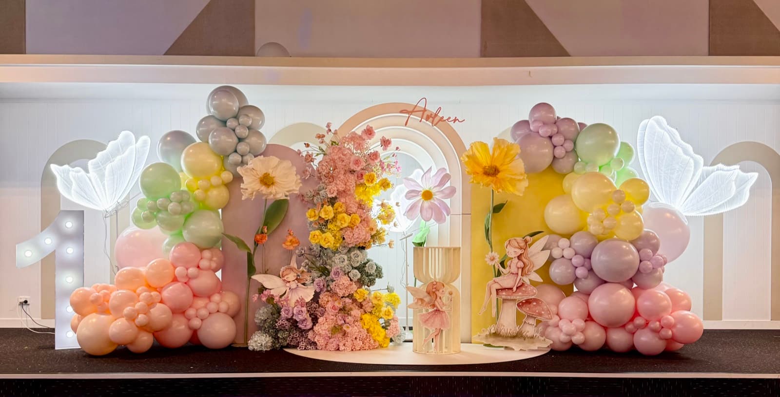 Baby shower event styling with pastel decorations and balloon arrangements
