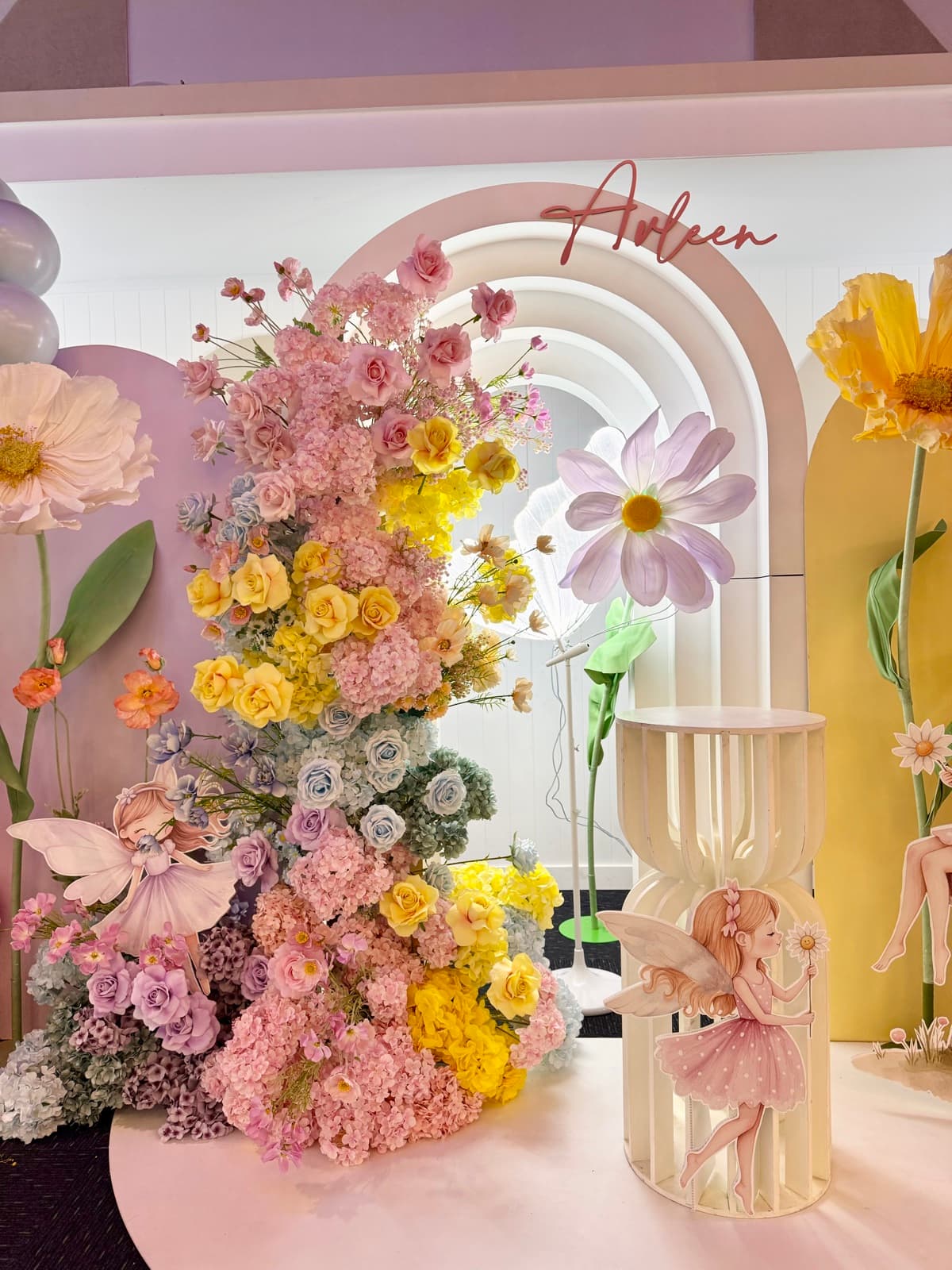 Baby shower event styling with pastel decorations and balloon arrangements