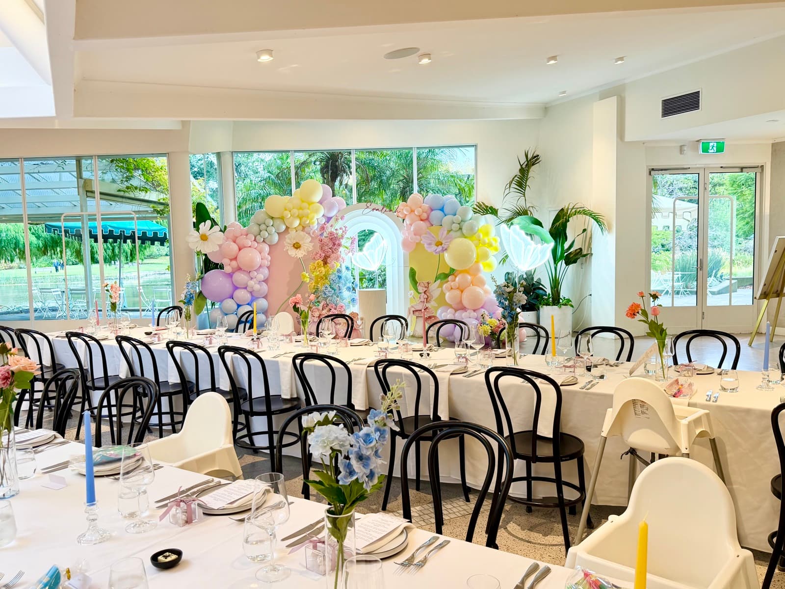 Baby shower event styling with pastel decorations and balloon arrangements
