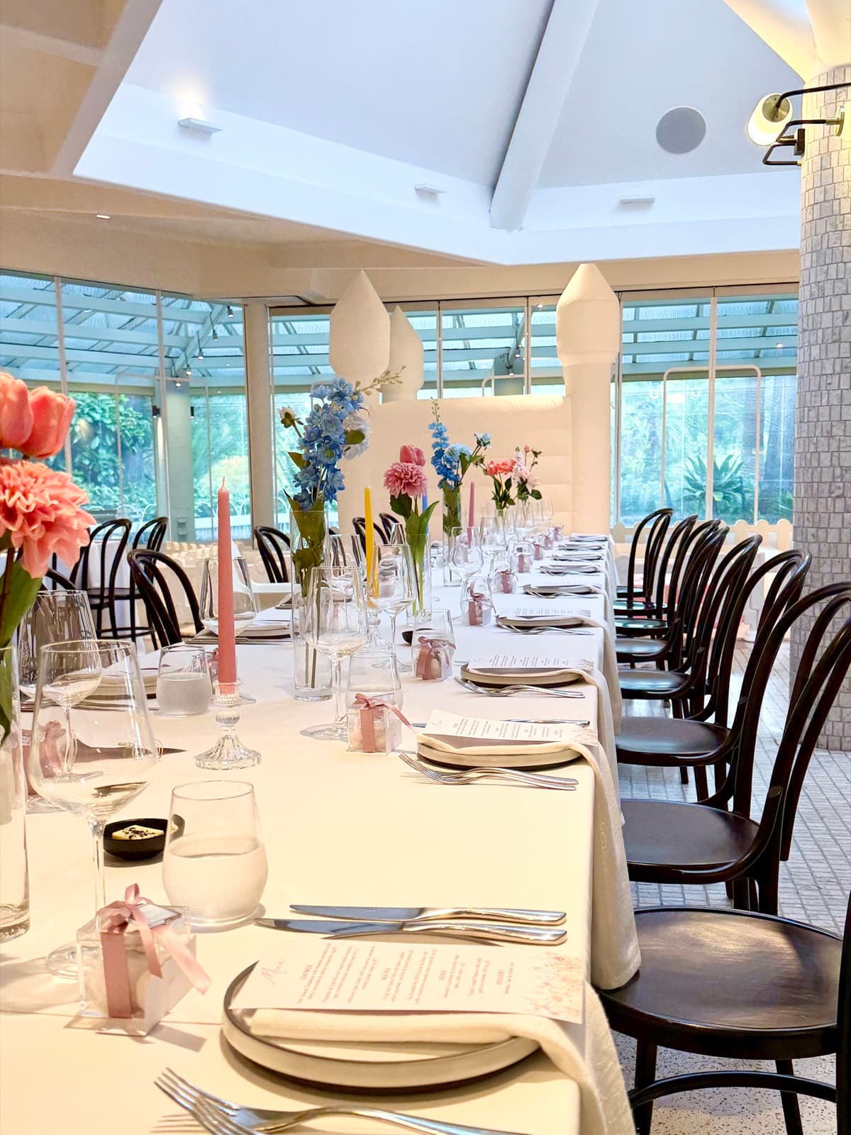 Baby shower event styling with pastel decorations and balloon arrangements