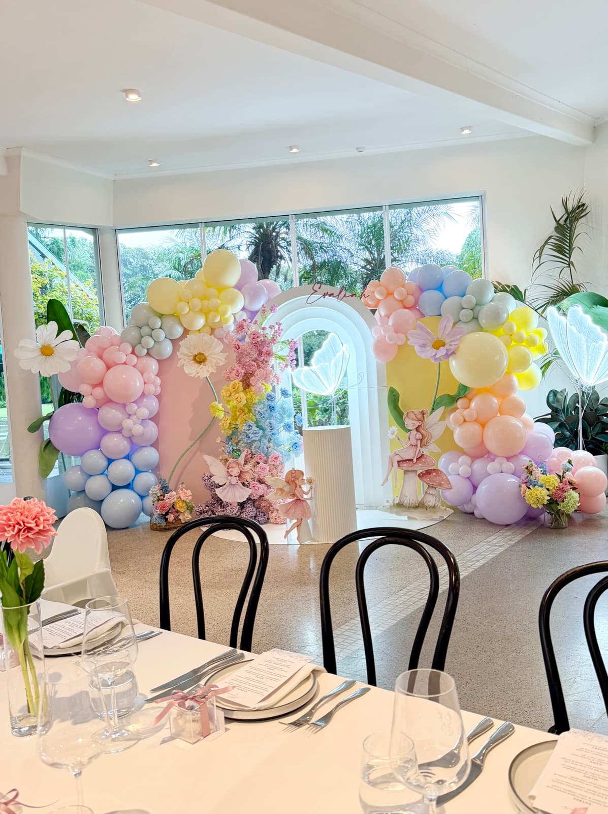 Baby shower event styling with pastel decorations and balloon arrangements