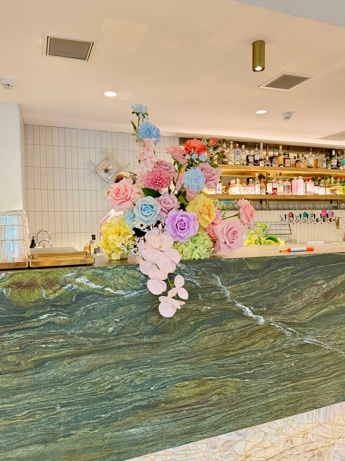 Baby shower event styling with pastel decorations and balloon arrangements
