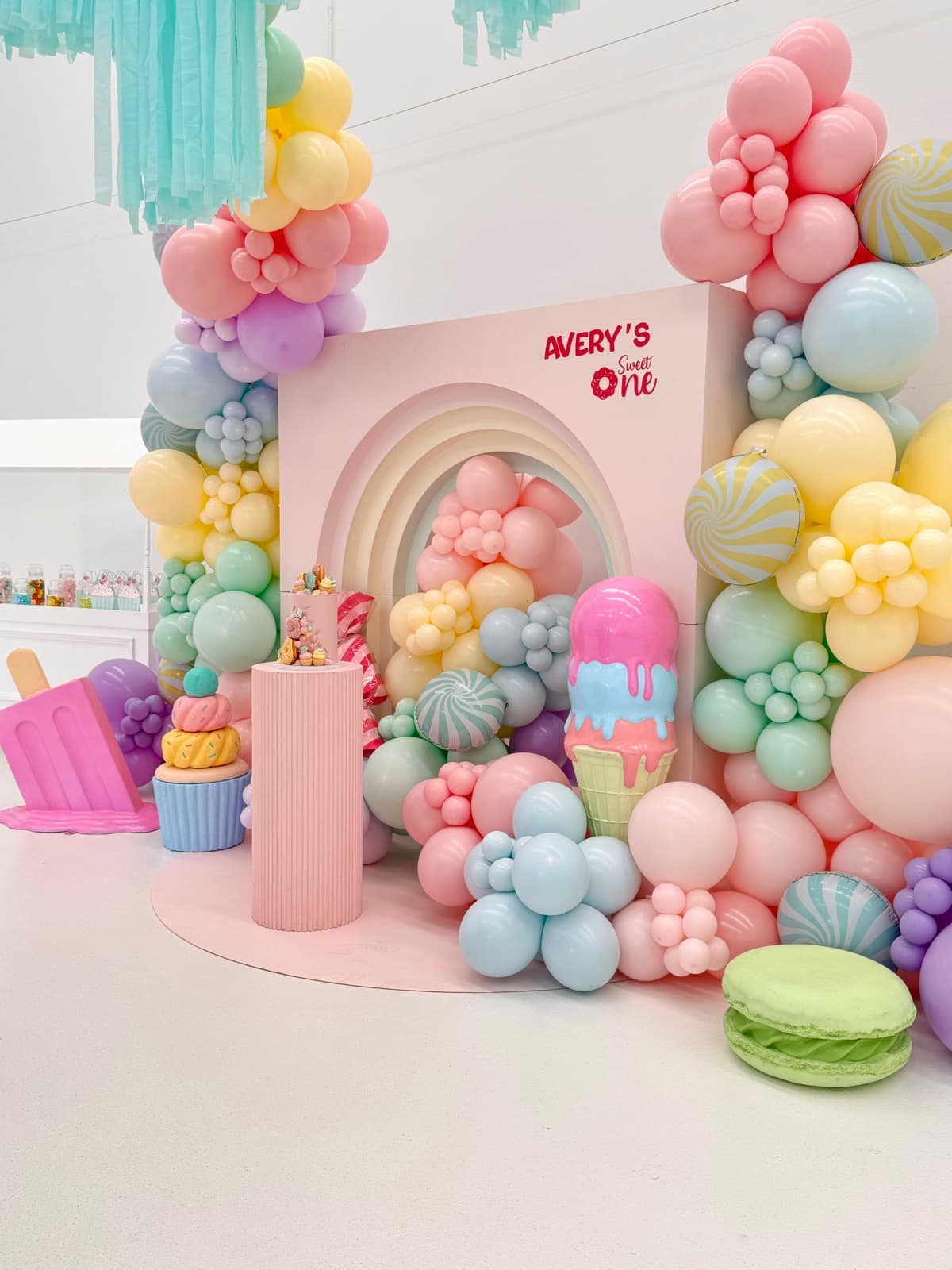 Birthday party styling with balloon installations and themed decorations