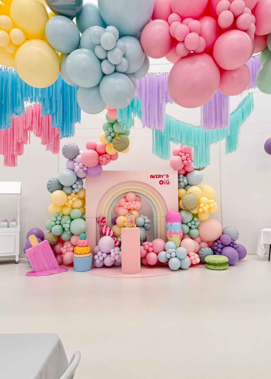 Birthday party styling with balloon installations and themed decorations