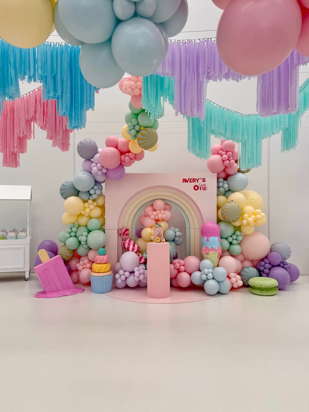 Birthday party styling with balloon installations and themed decorations