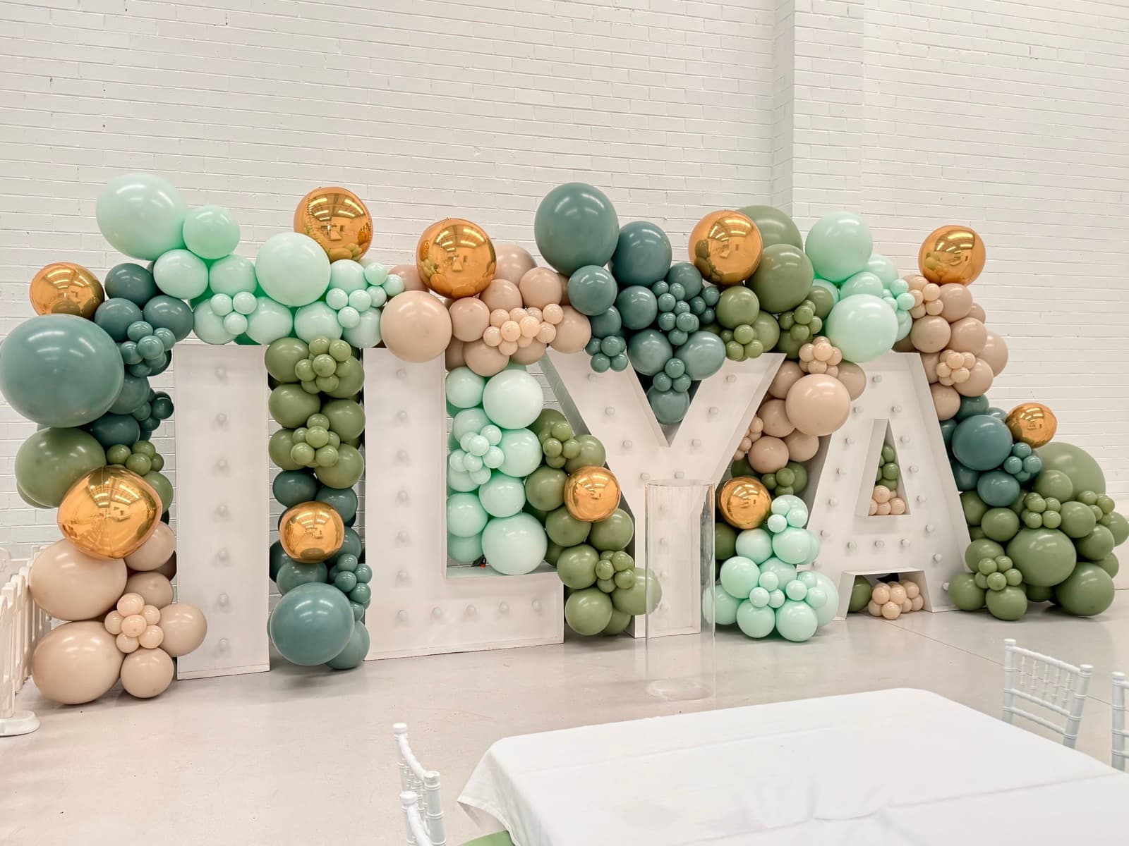 Birthday party styling with balloon installations and themed decorations
