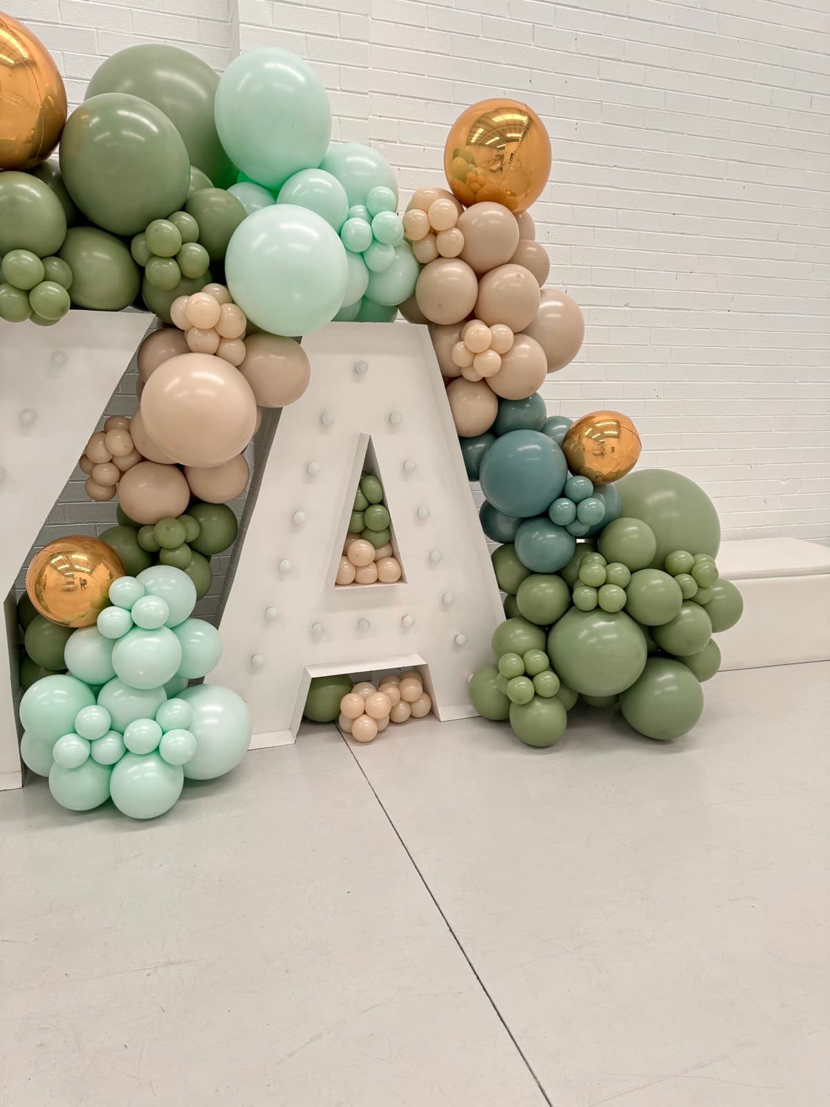 Birthday party styling with balloon installations and themed decorations