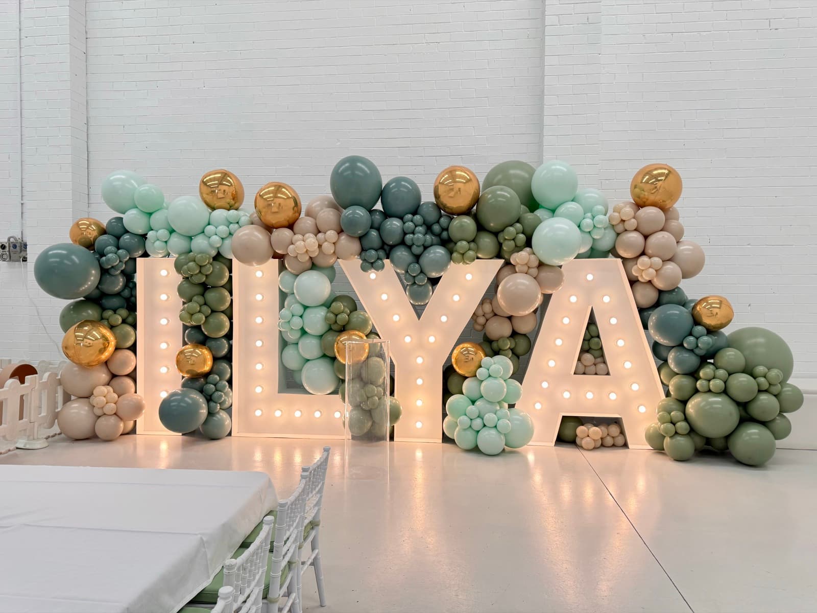 Birthday party styling with balloon installations and themed decorations