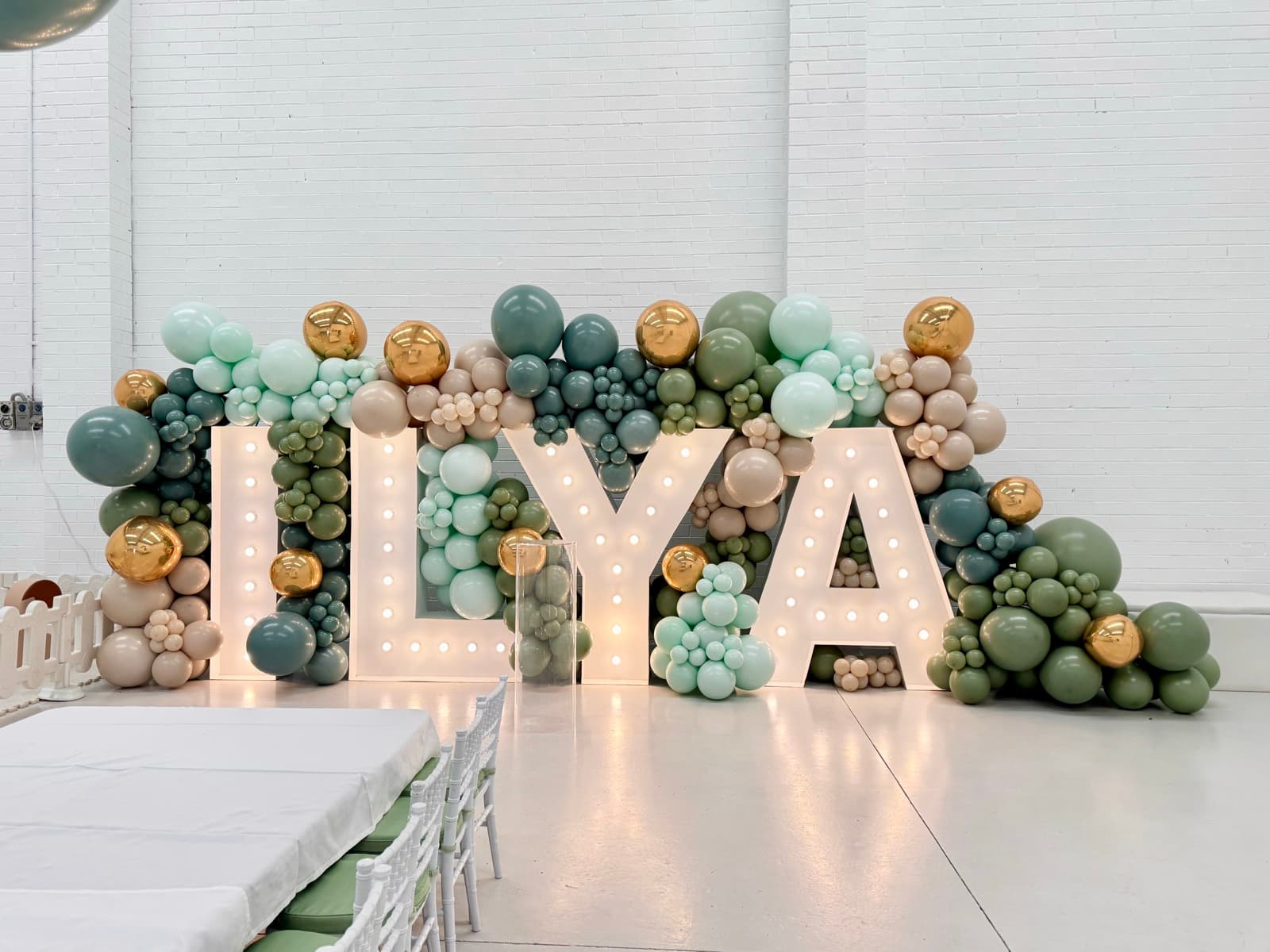 Birthday party styling with balloon installations and themed decorations