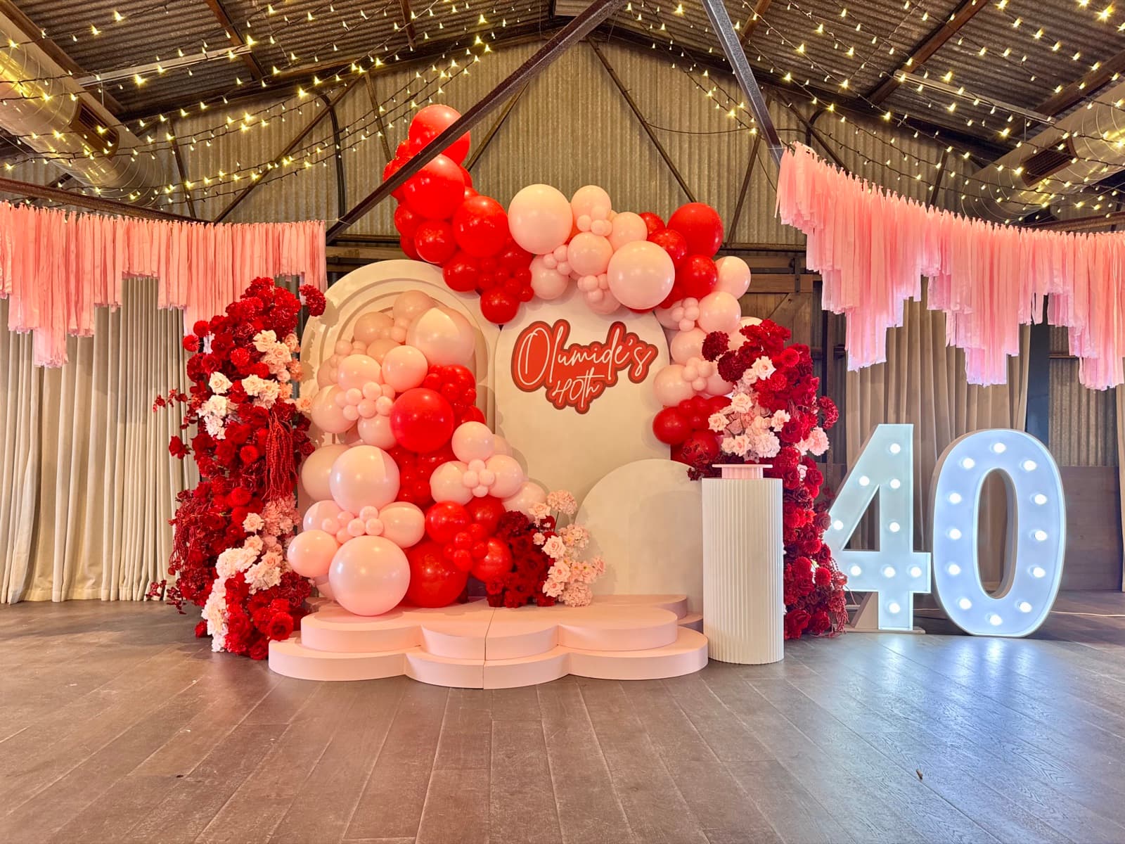 Birthday party styling with balloon installations and themed decorations
