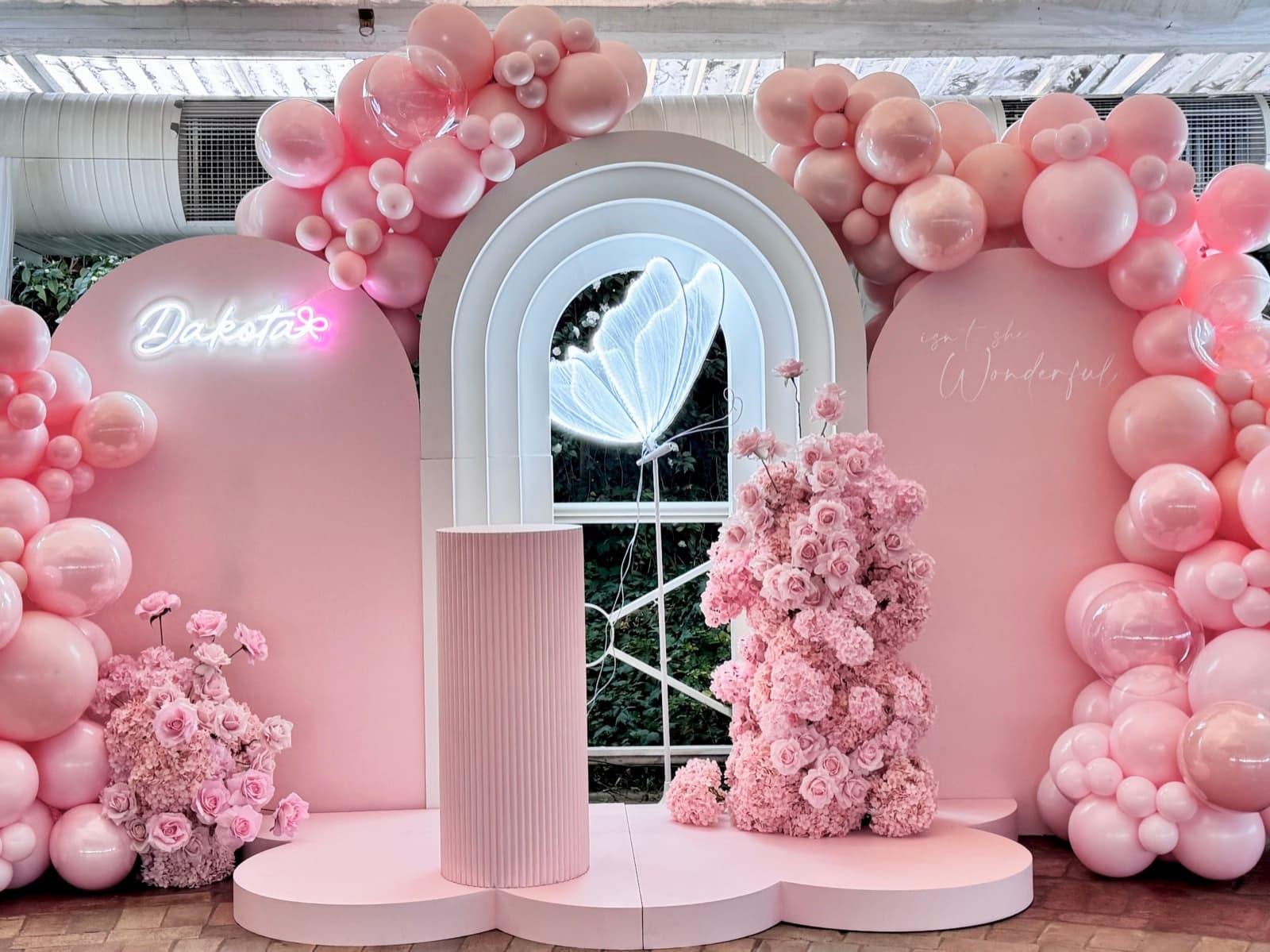 Birthday party styling with balloon installations and themed decorations