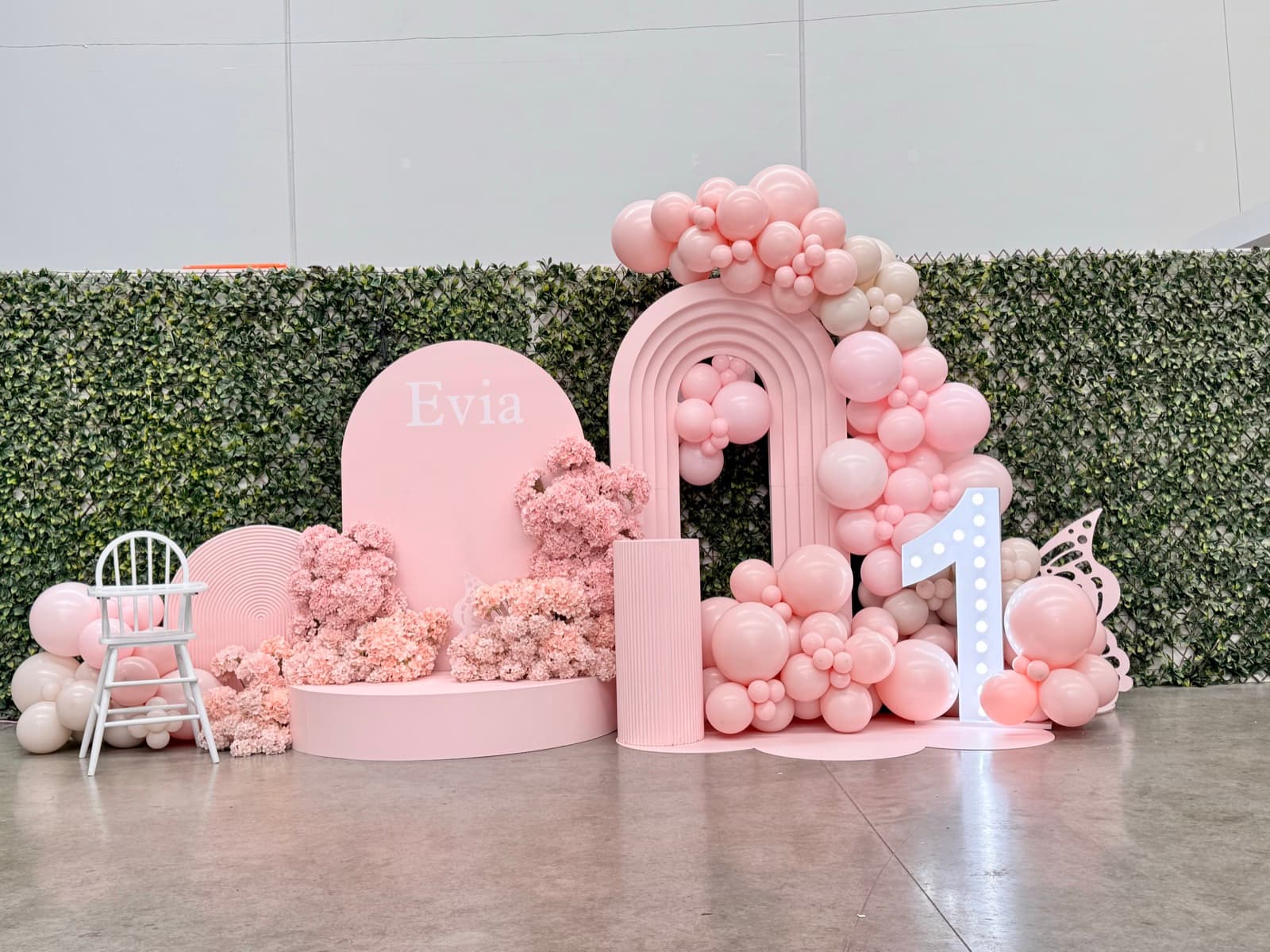 Birthday party styling with balloon installations and themed decorations