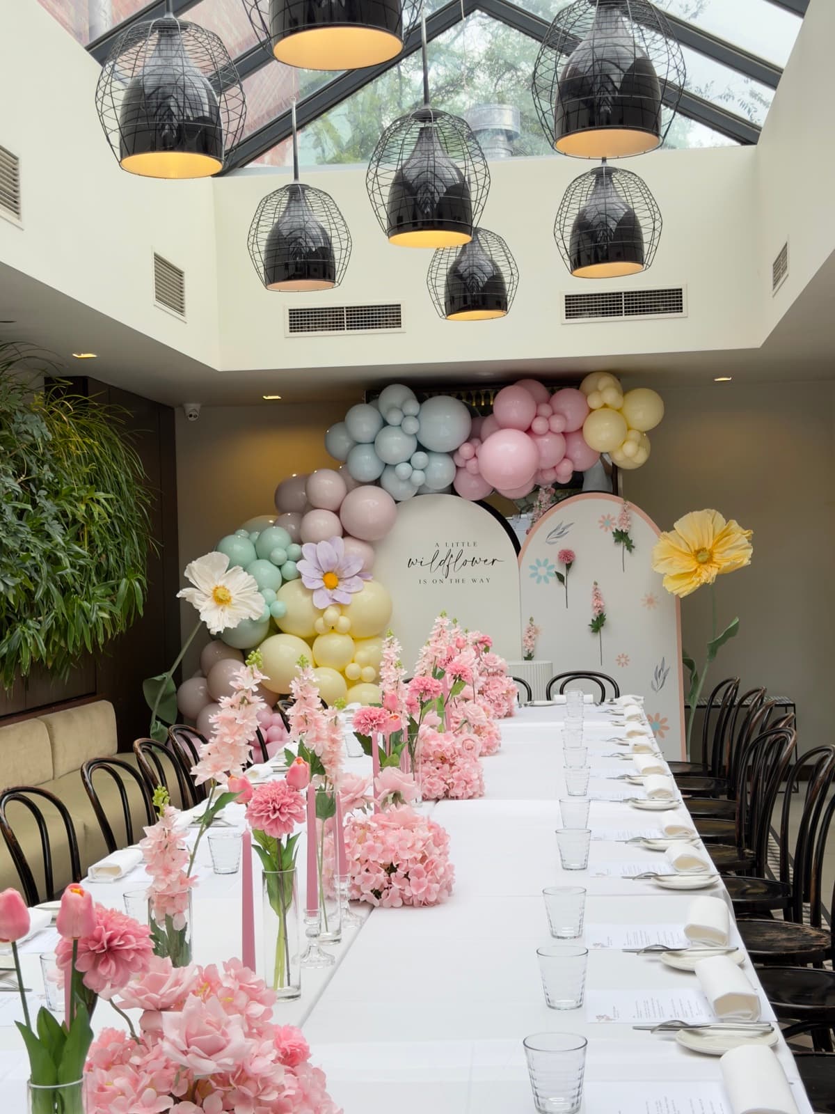 Birthday party styling with balloon installations and themed decorations