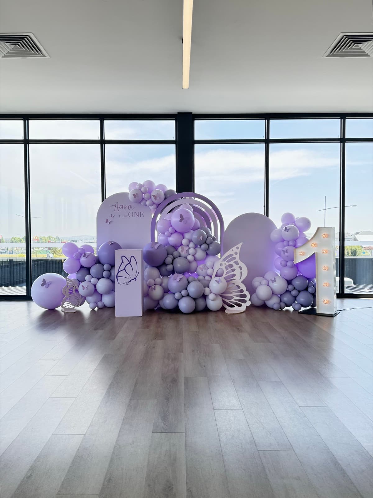 Birthday party styling with balloon installations and themed decorations