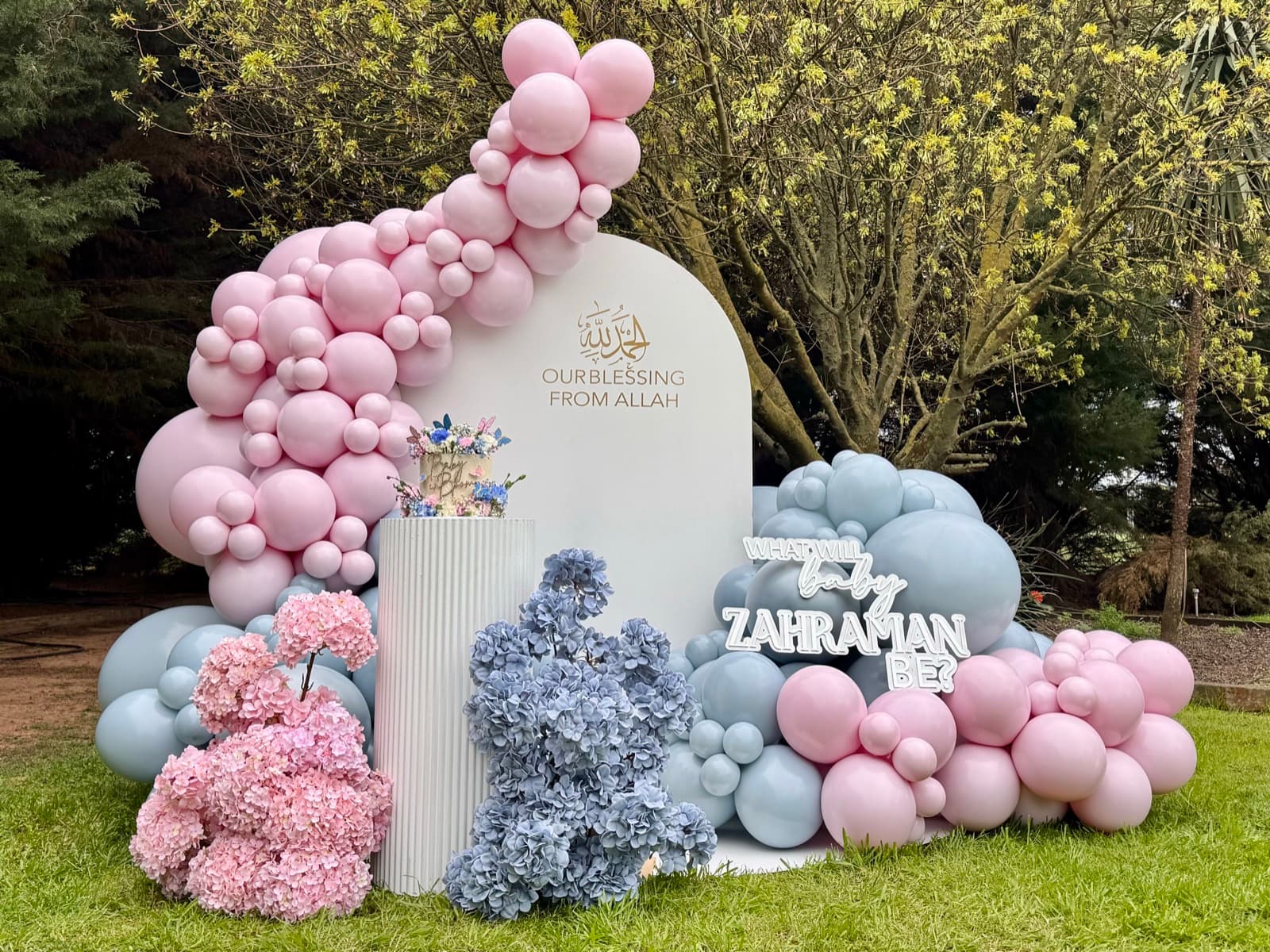 Birthday party styling with balloon installations and themed decorations