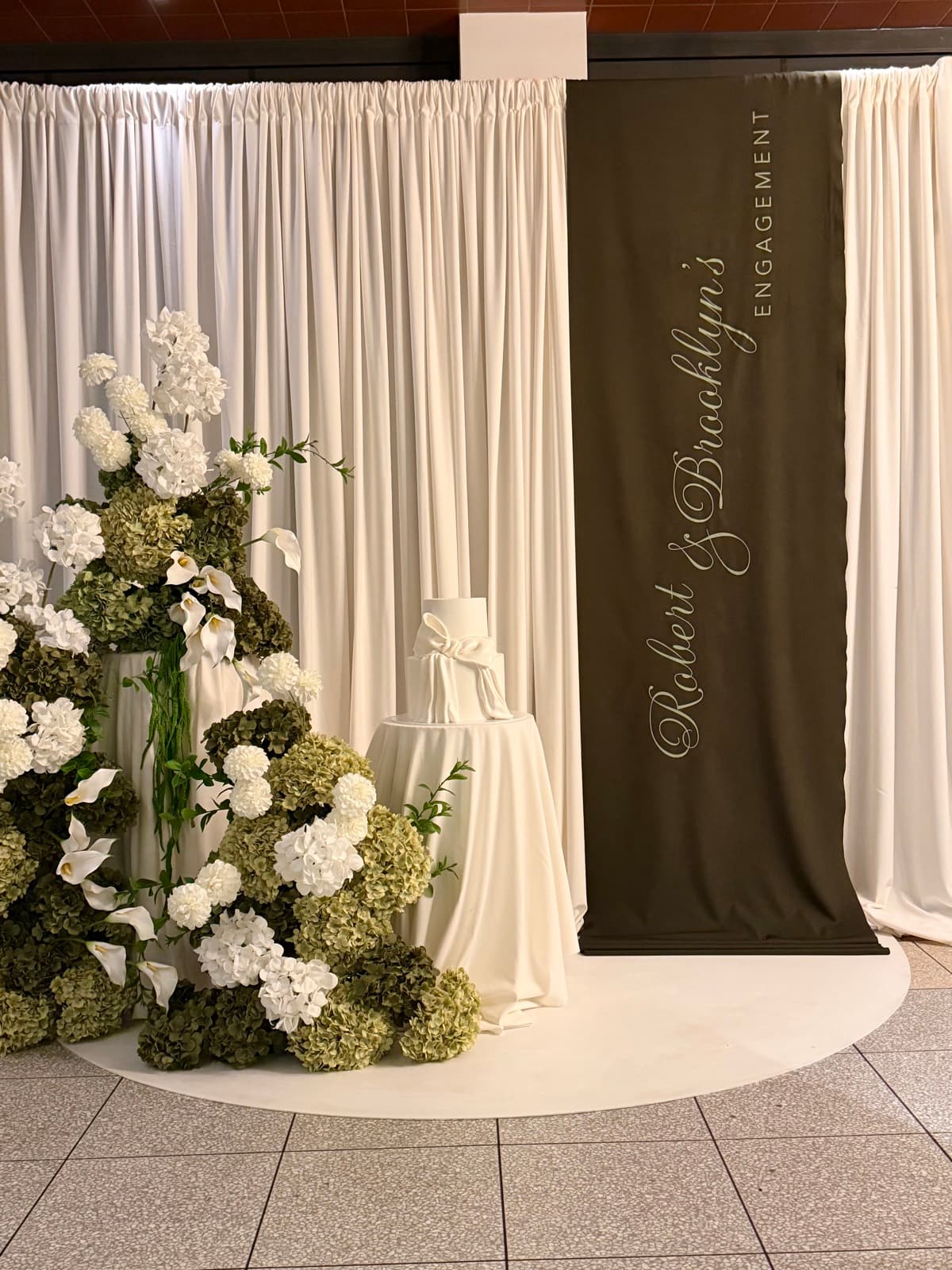 Engagement party styling with floral arrangements and elegant backdrops