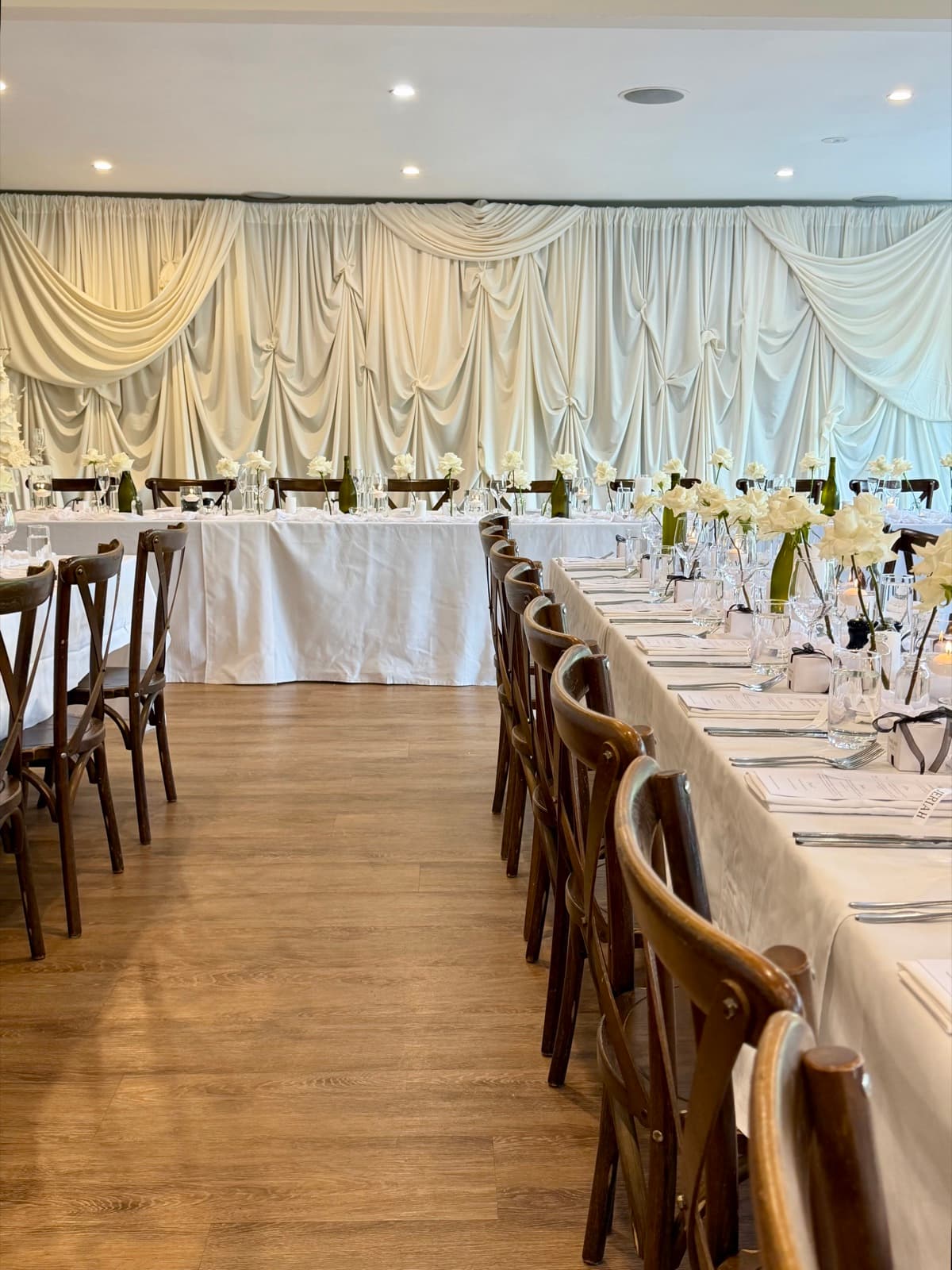 Wedding reception styling with draping florals and table settings